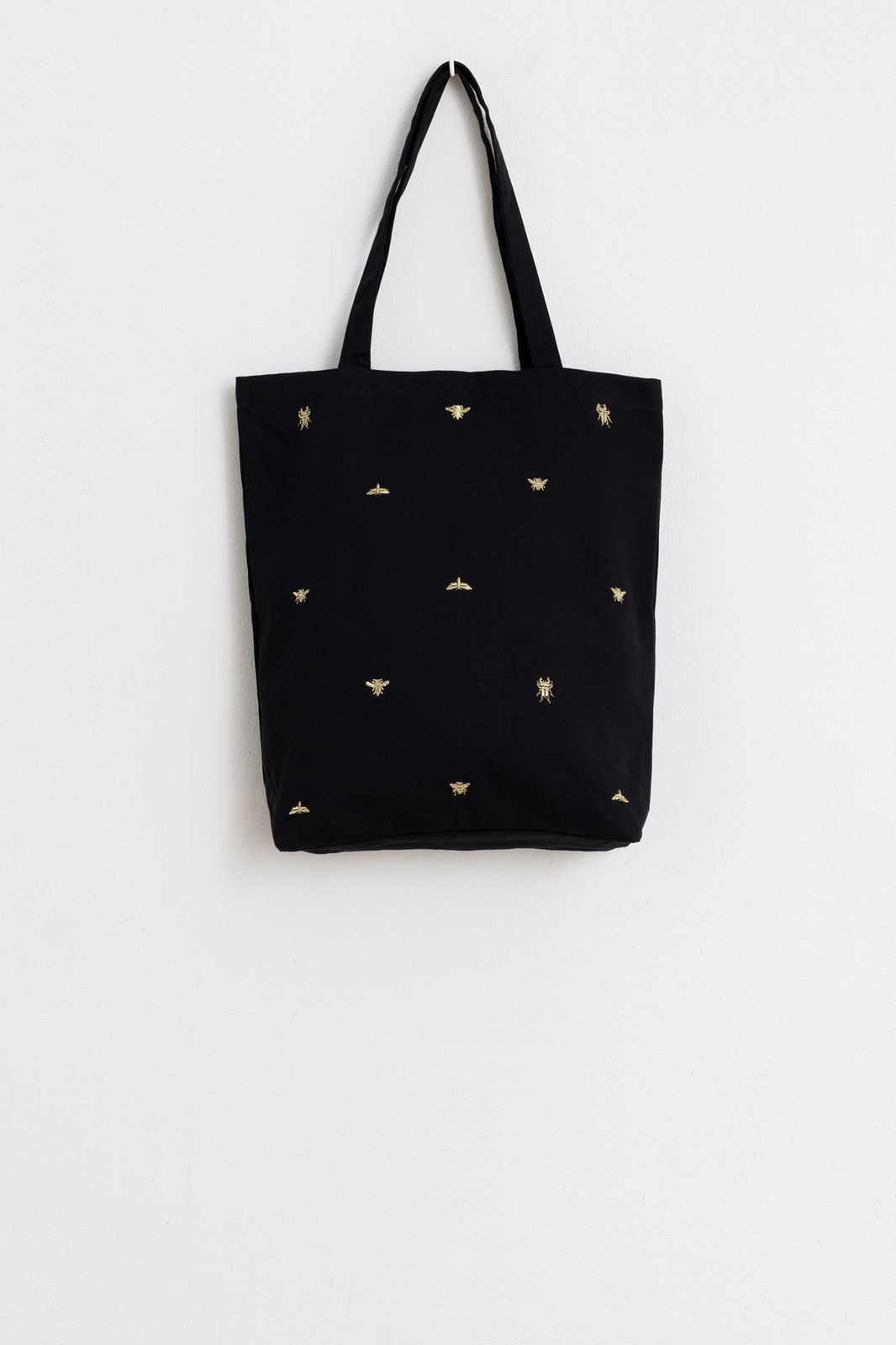 Zwarte tas met goudkleurige borduursels