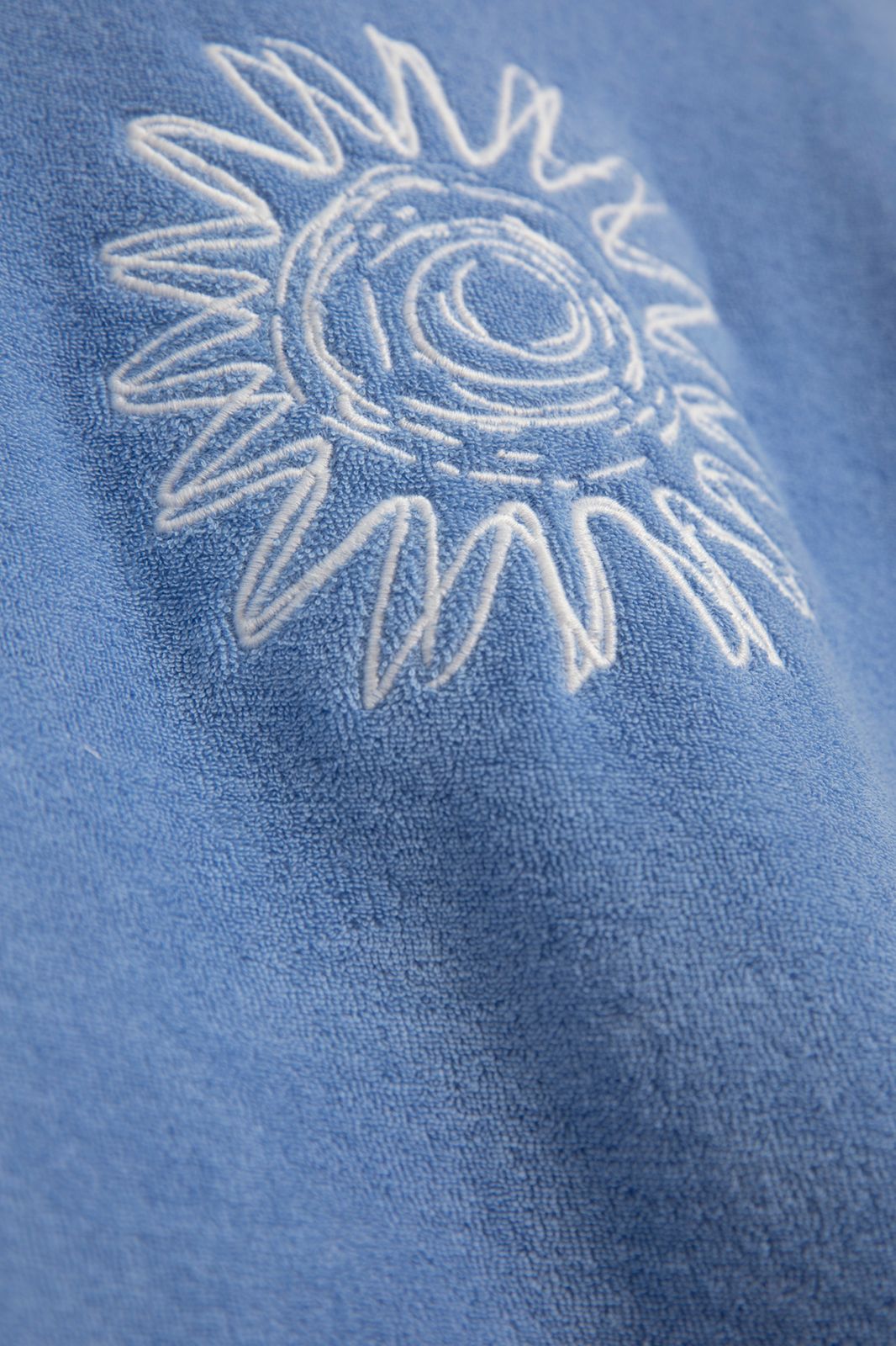 T-shirt en tissu éponge avec soleil - bleu