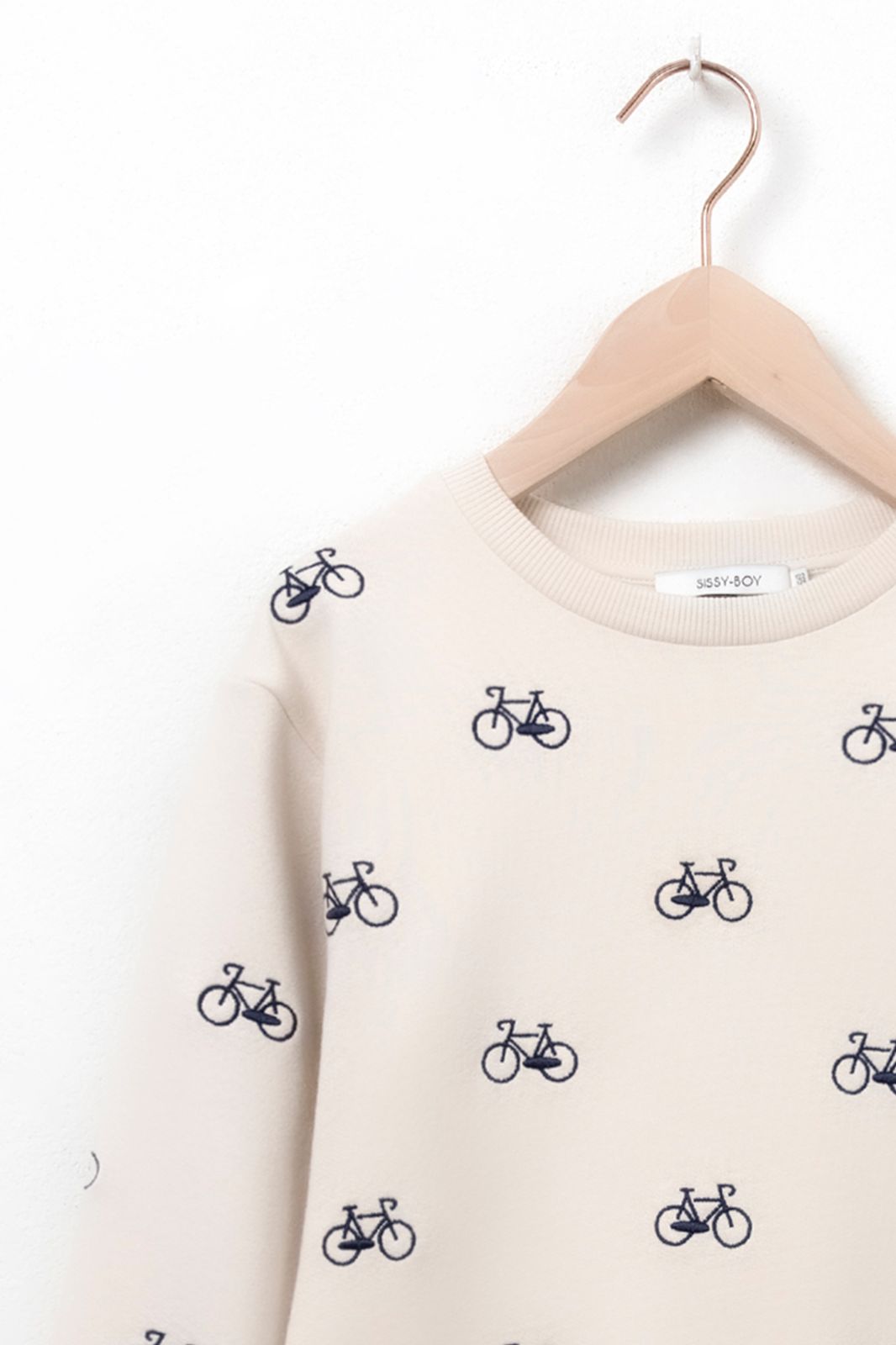 Beige sweater met fietsen embroidery