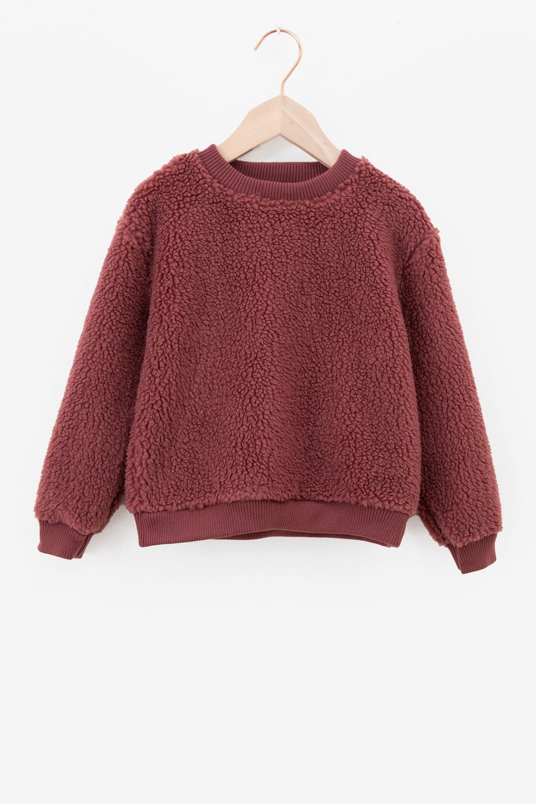 Donkerroze teddy sweater